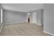 A neutral-toned bedroom featuring wood floors, with an ensuite bath at 12928 Lexington Summit St, Orlando, FL 32828