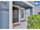 Close-up of the front door featuring black door and address at 12928 Lexington Summit St, Orlando, FL 32828