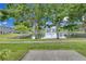 Community pond with fountain framed by trees and manicured lawn at 12928 Lexington Summit St, Orlando, FL 32828