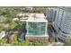 An aerial view of a high rise condo building with floor to ceiling windows and a community pool at 101 S Eola Dr # 812, Orlando, FL 32801