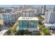 An aerial view of a high rise condo building with floor to ceiling windows and a community pool at 101 S Eola Dr # 812, Orlando, FL 32801