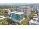 Aerial view of a modern high-rise building showcasing its unique architecture and surrounding urban landscape at 101 S Eola Dr # 812, Orlando, FL 32801
