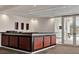 Interior wet bar and serving area leading to the community pool at 101 S Eola Dr # 812, Orlando, FL 32801