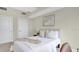 This bedroom features a queen bed and soft neutral colors at 101 S Eola Dr # 812, Orlando, FL 32801