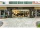 Close-up of the building entrance with a glass door and sleek, contemporary design at 101 S Eola Dr # 812, Orlando, FL 32801