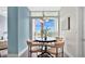 A cozy dining area is adjacent to a balcony with abundant natural light and attractive views at 101 S Eola Dr # 812, Orlando, FL 32801