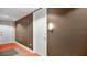 Well-lit hallway leading to condo entrance at 101 S Eola Dr # 812, Orlando, FL 32801