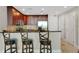 This kitchen features dark wood cabinets, stainless steel appliances, and a counter with bar stool seating at 101 S Eola Dr # 812, Orlando, FL 32801