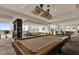 Comfortable lounge area with bar, billiards table, and floor-to-ceiling windows at 101 S Eola Dr # 812, Orlando, FL 32801
