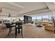Spacious lounge area with bar, billiard table, comfortable seating and floor-to-ceiling windows at 101 S Eola Dr # 812, Orlando, FL 32801