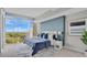 Serene bedroom with a large window, comfortable bedding, and modern decor, creating a relaxing retreat at 101 S Eola Dr # 812, Orlando, FL 32801