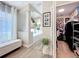 Bright bathroom with a large tub, and access to the closet, and white walls at 10105 Dean Point Pl, Orlando, FL 32825