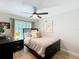 This is a modern bedroom with new floors, ceiling fan, and neutral paint at 10105 Dean Point Pl, Orlando, FL 32825