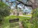 Charming home with a swing, mature trees, and lush green lawn at 10105 Dean Point Pl, Orlando, FL 32825