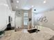 Stylish kitchen with granite countertops, a sink island, white cabinets, and stainless steel appliances at 10105 Dean Point Pl, Orlando, FL 32825