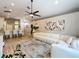 Open concept living room and kitchen area with bright, modern decor and stylish furniture at 10105 Dean Point Pl, Orlando, FL 32825