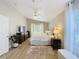 Comfortable main bedroom boasts a ceiling fan, a charming rug, and a beautifully designed interior at 10105 Dean Point Pl, Orlando, FL 32825
