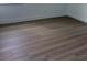 Close-up on the bedroom's dark wood flooring and modern base trim at 1016 Gloryland Ct, Sanford, FL 32771