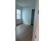 Clean bedroom featuring light wood floors, a window, and a closet at 1016 Gloryland Ct, Sanford, FL 32771