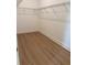 Spacious walk-in closet with wood flooring and wire shelving for optimal organization at 1016 Gloryland Ct, Sanford, FL 32771