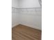 Spacious walk-in closet with wood floor and ample shelving for optimal storage solutions at 1059 Gloryland Ct, Sanford, FL 32771