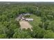 Expansive horse property featuring a barn, riding arena, paddocks with white fencing, and lush greenery at 111 Crown Oaks Way # 101, Longwood, FL 32779