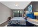 Comfortable bedroom featuring a private patio, stylish furnishings, and a serene atmosphere at 111 Crown Oaks Way # 101, Longwood, FL 32779