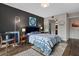 Stylish bedroom with gray accent wall, hardwood floors, modern lighting, and contemporary decor at 111 Crown Oaks Way # 101, Longwood, FL 32779