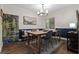 Inviting dining room with modern chandelier, bench seating, and stylish decor, perfect for entertaining at 111 Crown Oaks Way # 101, Longwood, FL 32779