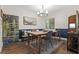 Dining room featuring elegant lighting, wainscoting, stylish decor and a view to the outdoors at 111 Crown Oaks Way # 101, Longwood, FL 32779