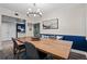 Open-concept dining area with a wooden table, stylish chairs, and seamless flow into the living spaces at 111 Crown Oaks Way # 101, Longwood, FL 32779