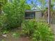 Two-story home surrounded by trees with a balcony at 111 Crown Oaks Way # 101, Longwood, FL 32779