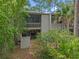 Two-story home with a balcony, brick patio and lush greenery at 111 Crown Oaks Way # 101, Longwood, FL 32779
