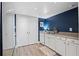 Well-equipped kitchen with white cabinetry, stainless steel appliances, and ample counter space for meal preparation at 111 Crown Oaks Way # 101, Longwood, FL 32779