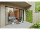 Charming private patio connected to a stylish bedroom with lush greenery, offering a relaxing outdoor space at 111 Crown Oaks Way # 101, Longwood, FL 32779