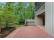Peaceful patio space with brick pavers that overlooks lush landscaping and trees, ideal for enjoying nature at 111 Crown Oaks Way # 101, Longwood, FL 32779