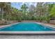 Refreshing community pool surrounded by lush landscaping, perfect for relaxation and enjoying the outdoors at 111 Crown Oaks Way # 101, Longwood, FL 32779