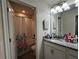 Bathroom featuring a vanity, a mirror, decorative light fixture, and a shower and tub with curtain at 11456 Short Story St, Orlando, FL 32832