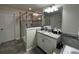 This bathroom features a walk-in shower with granite counters at 11456 Short Story St, Orlando, FL 32832