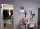 This pink bedroom has a closet and a desk at 11456 Short Story St, Orlando, FL 32832
