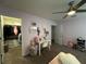 The carpeted bedroom features a walk-in closet and ceiling fan at 11456 Short Story St, Orlando, FL 32832