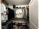 Walk-in closet with shelving, hanging racks and shoe storage at 11456 Short Story St, Orlando, FL 32832