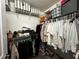 Walk-in closet with shelving and hanging racks for clothing and accessories at 11456 Short Story St, Orlando, FL 32832