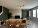 Living room with a modern barn door, stylish decor, and neutral color palette offering a cozy atmosphere at 11456 Short Story St, Orlando, FL 32832