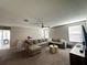 Comfortable living room featuring a plush sectional sofa and modern entertainment center at 11456 Short Story St, Orlando, FL 32832