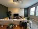 Inviting living room featuring neutral decor, a stylish barn door, and plenty of natural light at 11456 Short Story St, Orlando, FL 32832