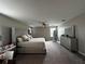 Spacious bedroom featuring a king bed, dresser, and a full-length mirror at 11456 Short Story St, Orlando, FL 32832