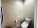 This powder room features neutral walls and tile flooring at 11456 Short Story St, Orlando, FL 32832