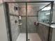 This walk-in shower features tile surround and a glass door at 11456 Short Story St, Orlando, FL 32832