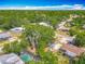 Aerial view of the home surrounded by lush greenery in a vibrant neighborhood at 1298 Scottsdale Dr, Ormond Beach, FL 32174